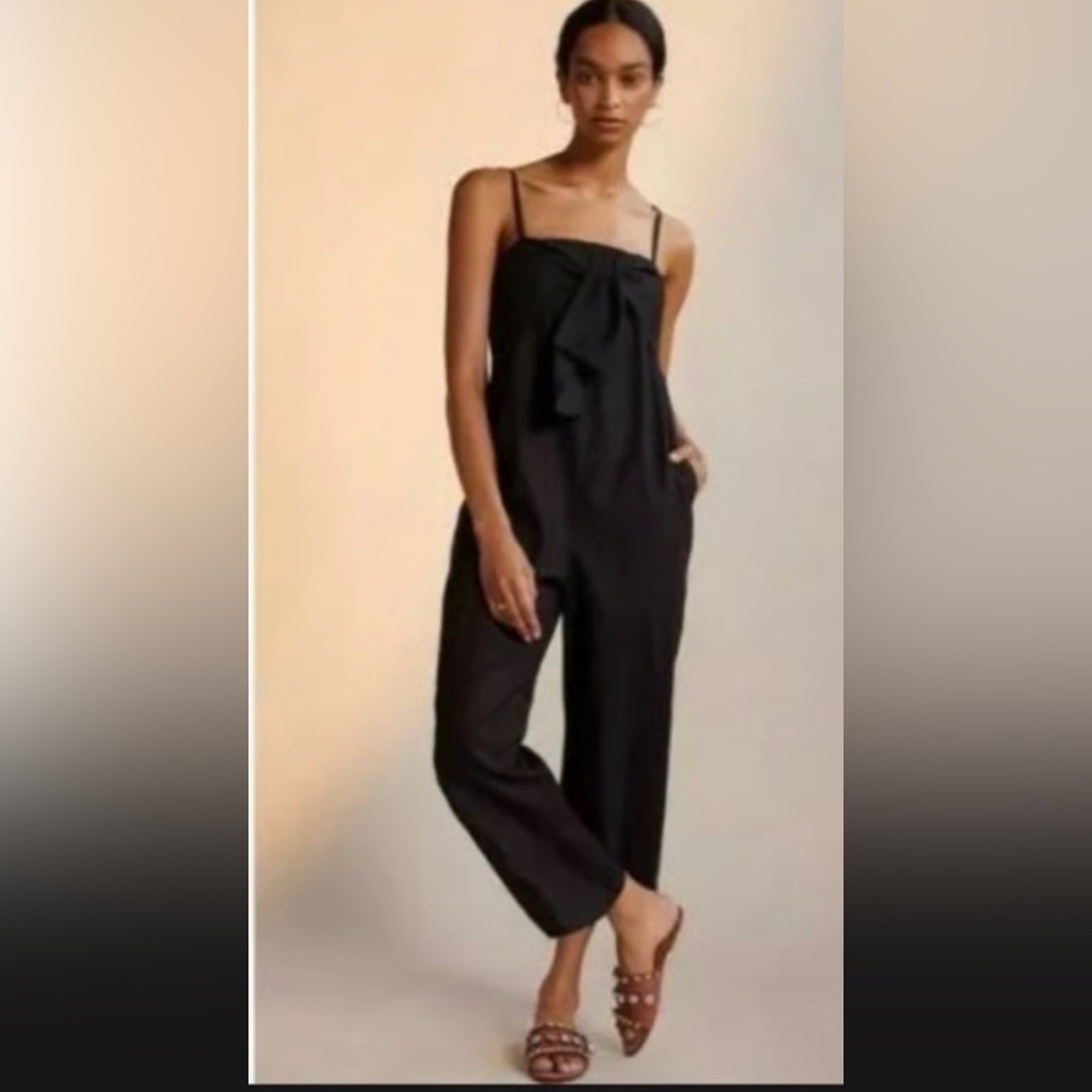 NWT. Retail $180, size S, Hutch Black Satin Jumpsuit. Bow-Tie front, wide leg.